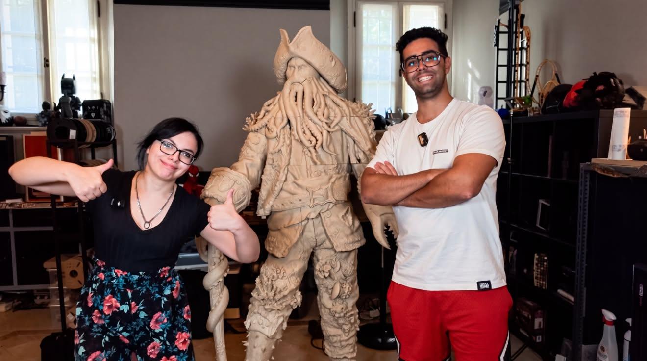 Nora and Nicola on either side of the 3D-printed Davy Jones statue, still unpainted, in their workshop