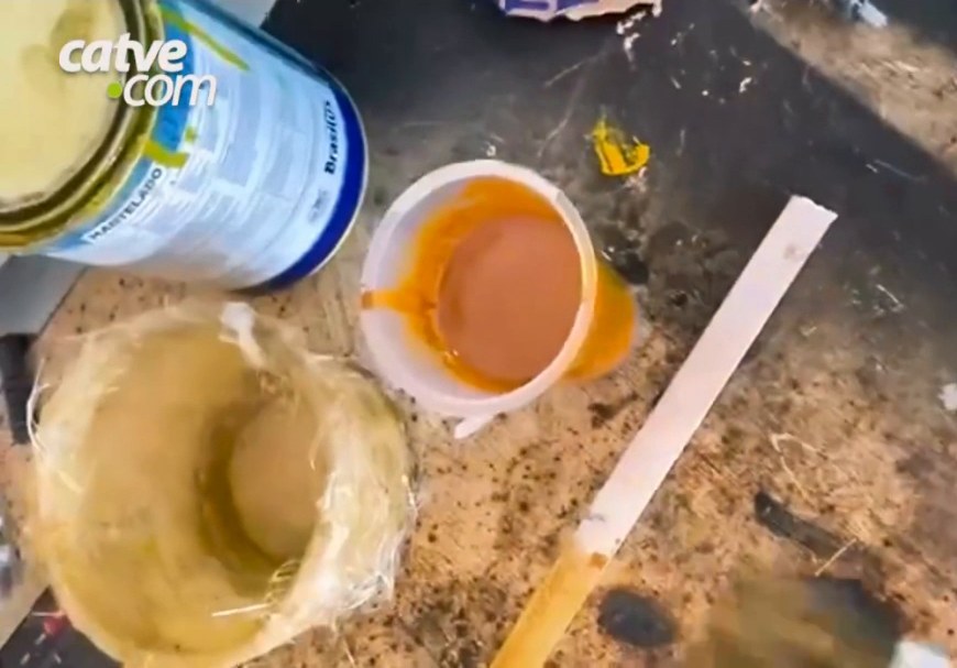 Paint cans and mixes on a workbench
