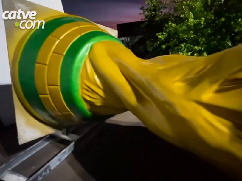 Close-up of the green and gold base and the golden body of the trophy