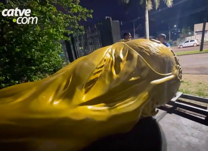 Golden trophy lying in the yard at night