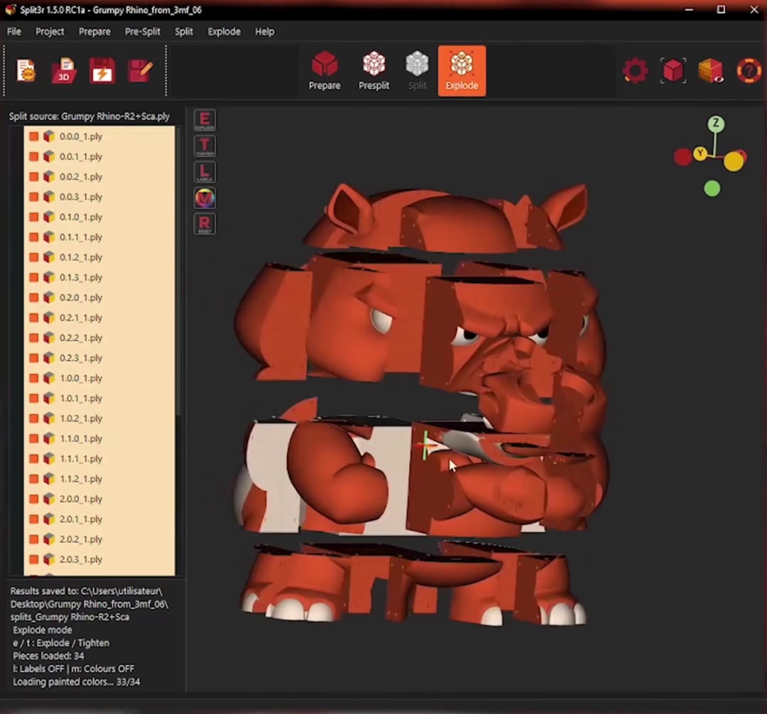 The rhino split into 34 body parts in Split3r Explode, with its original red and white painting still visible on the separated pieces.